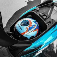 Honda Elite 125 2025: Scooter azul, porta-capacete, design moderno, praticidade urbana